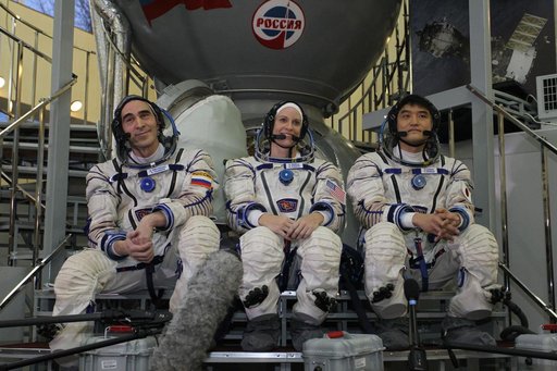 At the Gagarin Cosmonaut Training Center in Star City, Russia, Expedition 46-47 backup crewmembers Anatoly Ivanishin of the Russian Federal Space Agency (Roscosmos, left), Kate Rubins of NASA (center) and Takuya Onishi of the Japan Aerospace Exploration Agency (right) listen to reporters��� question