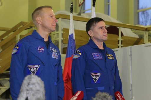 At the Gagarin Cosmonaut Training Center in Star City, Russia, Expedition 46-47 prime crewmembers Tim Kopra of NASA (left) and Yuri Malenchenko of the Russian Federal Space Agency (Roscosmos, right) answer reporters��� questions Nov. 19 at the start of two days of qualification exams. Along with Tim