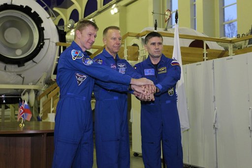 At the Gagarin Cosmonaut Training Center in Star City, Russia, Expedition 46-47 prime crewmembers Tim Peake of the European Space Agency (left), Tim Kopra of NASA (center) and Yuri Malenchenko of the Russian Federal Space Agency (Roscosmos, right) pose for pictures Nov. 19 at the start of two days o