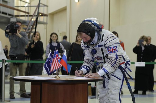 At the Gagarin Cosmonaut Training Center in Star City, Russia, Expedition 46-47 crewmember Tim Peake of the European Space Agency signs in for his qualification exam Nov. 20. Along with Yuri Malenchenko of the Russian Federal Space Agency (Roscosmos) and Tim Kopra of NASA, Peake will launch Dec. 15 