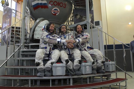 At the Gagarin Cosmonaut Training Center in Star City, Russia, Expedition 46-47 crewmembers Tim Peake of the European Space Agency (left), Yuri Malenchenko of the Russian Federal Space Agency (Roscosmos, center) and Tim Kopra of NASA (right) pose for pictures at the start of their final qualificatio
