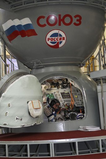 At the Gagarin Cosmonaut Training Center in Star City, Russia, Expedition 46-47 crewmember Yuri Malenchenko of the Russian Federal Space Agency (Roscosmos) reviews procedures inside a Soyuz spacecraft simulator Nov. 20 at the start of final qualification exams. Malenchenko and crewmates Tim Peake of