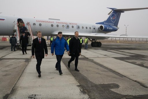 The Expedition 46-47 crewmembers arrive in Baikonur, Kazakhstan Nov. 30 for final pre-launch training following a flight from their training base at the Gagarin Cosmonaut Training Center in Star City, Russia. Tim Peake of the European Space Agency (left), Yuri Malenchenko of the Russian Federal Spac