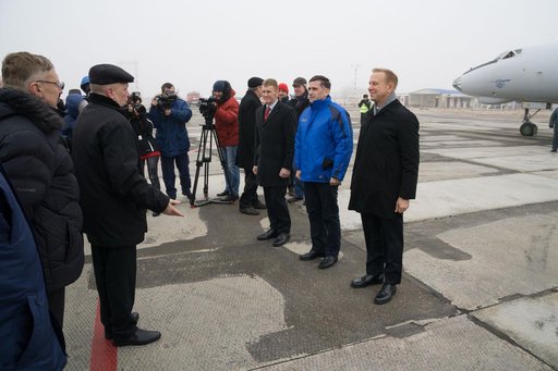 The Expedition 46-47 crewmembers arrive in Baikonur, Kazakhstan Nov. 30 for final pre-launch training following a flight from their training base at the Gagarin Cosmonaut Training Center in Star City, Russia. On the right of the frame are Tim Peake of the European Space Agency (left), Yuri Malenchen