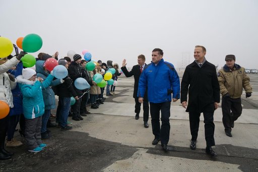 The Expedition 46-47 crewmembers arrive in Baikonur, Kazakhstan Nov. 30 for final pre-launch training following a flight from their training base at the Gagarin Cosmonaut Training Center in Star City, Russia and are greeted by school children. Tim Peake of the European Space Agency (left), Yuri Male