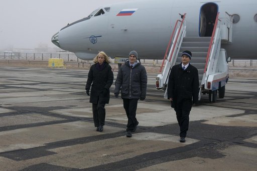 The Expedition 46-47 backup crewmembers arrive in Baikonur, Kazakhstan Nov. 30 for final pre-launch preparations. Kate Rubins of NASA (left), Anatoly Ivanishin of the Russian Federal Space Agency (Roscosmos, center) and Takuya Onishi of the Japan Aerospace Exploration Agency (JAXA, right) will serve