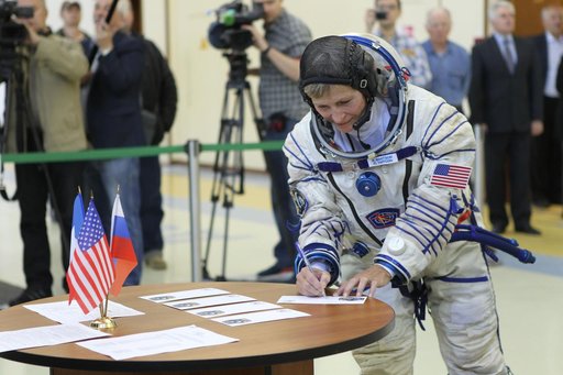 At the Gagarin Cosmonaut Training Center in Star City, Russia, Expedition 48-49 backup crewmember Peggy Whitson of NASA signs in for Soyuz qualification exams May 26. Whitson, Thomas Pesquet of the European Space Agency and Oleg Novitskiy of Roscosmos are serving as the backups to prime crewmembers 