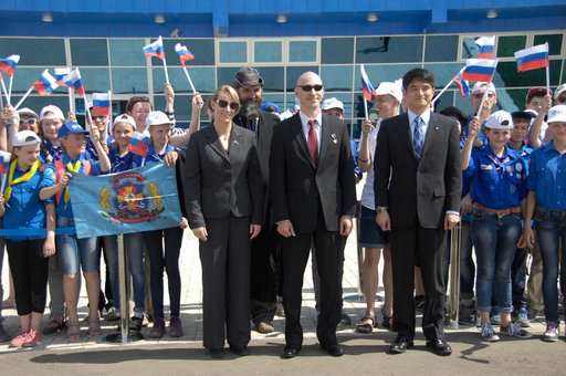 ISS Expedition 48-49 prime crewmembers Kate Rubins of NASA (left), Anatoly Ivanishin of Roscosmos (center) and Takuya Onishi of the Japan Aerospace Exploration Agency (right) pose for pictures with schoolchildren after arriving in Baikonur, Kazakhstan June 24 for final pre-launch training following 