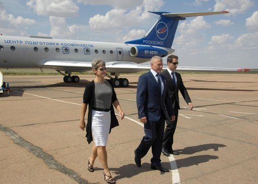 ISS Expedition 48-49 backup crewmembers Peggy Whitson of NASA (left), Oleg Novitskiy of Roscosmos (center) and Thomas Pesquet of the European Space Agency (right) arrive in Baikonur, Kazakhstan June 24 following a flight from their training base in Star City, Russia. Prime crewmembers Kate Rubins of