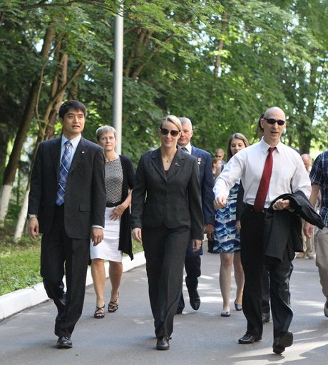 At the Gagarin Cosmonaut Training Center in Star City, Russia, ISS Expedition 48-49 prime crewmembers Takuya Onishi of the Japan Aerospace Exploration Agency (left), Kate Rubins of NASA (center) and Anatoly Ivanishin of Roscosmos (right) walk to their bus June 24 as they departed for their launch si