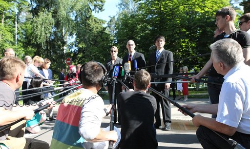 At the Gagarin Cosmonaut Training Center in Star City, Russia, ISS Expedition 48-49 crewmembers Kate Rubins of NASA (left), Anatoly Ivanishin of Roscosmos (center) and Takuya Onishi of the Japan Aerospace Exploration Agency (right) answer questions from reporters June 24 before departing for their l
