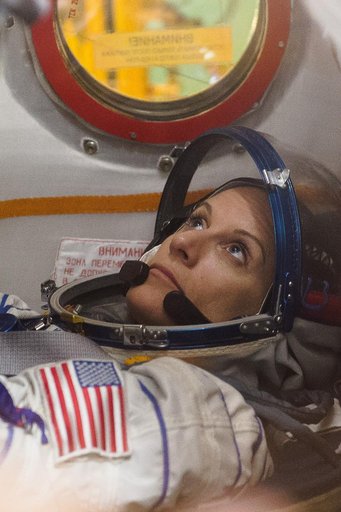 In the Integration Facility at the Baikonur Cosmodrome in Kazakhstan, Expedition 48-49 crewmember Kate Rubins of NASA conducts a �ޔfit check��� familiarization aboard the Soyuz MS-01 spacecraft June 25 as part of the preparations for launch with Anatoly Ivanishin of Roscosmos and Takuya Onishi of th