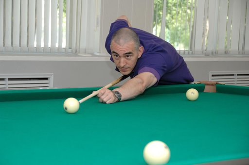 At the Cosmonaut Hotel in Baikonur, Kazakhstan, Expedition 48-49 crewmember Anatoly Ivanishin of Roscosmos tries his hand a billiards June 30 during pre-launch activities. Ivanishin, Takuya Onishi of the Japan Aerospace Exploration Agency and Kate Rubins of NASA will launch July 7, Baikonur time, on