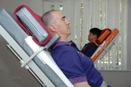 At the Cosmonaut Hotel in Baikonur, Kazakhstan, Expedition 48-49 crewmembers Anatoly Ivanishin of Roscosmos (foreground) and Takuya Onishi of the Japan Aerospace Exploration Agency conduct tests of their vestibular system on tilt tables June 30 as part of pre-launch activities. They and Kate Rubins 