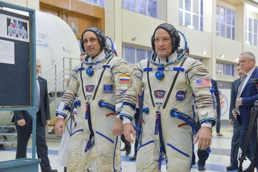 jsc2017e135203 - At the Gagarin Cosmonaut Training Center in Star City, Russia, Expedition 54-55 prime crewmembers Anton Shkaplerov of the Russian Federal Space Agency (Roscosmos, left) and Scott Tingle of NASA (right) walk through a Soyuz spacecraft simu