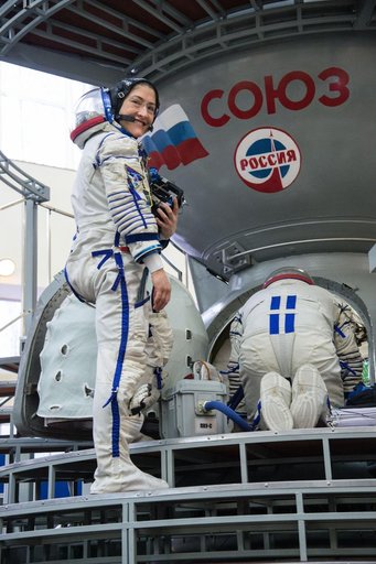 jsc2019e004058 - At the Gagarin Cosmonaut Training Center in Star City, Russia, Expedition 59 crewmember Christina Koch of NASA boards a Soyuz spacecraft simulator Feb. 20 during the second day of final pre-launch qualifications exams. Koch, Nick Hague of