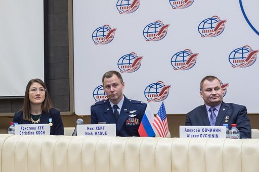 jsc2019e004417 - At the Gagarin Cosmonaut Training Center in Star City, Russia, Expedition 59 crewmembers Christina Koch of NASA (left), Nick Hague of NASA (center) and Alexey Ovchinin of Roscosmos (right) listen to reportersâ€™ questions Feb. 21 during a
