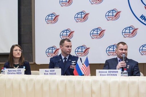 jsc2019e004420 - At the Gagarin Cosmonaut Training Center in Star City, Russia, Expedition 59 crewmember Alexey Ovchinin of Roscosmos (right) responds to a reporterâ€™s question Feb. 21 during a pre-launch news conference as crewmates Christina Koch of NA