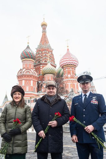 jsc2019e004430 - With St. Basilâ€™s Cathedral in Red Square in Moscow providing a wintry backdrop, Expedition 59 crewmembers Christina Koch of NASA (left), Alexey Ovchinin of Roscosmos (center) and Nick Hague of NASA (right) pose for pictures Feb. 21 prio