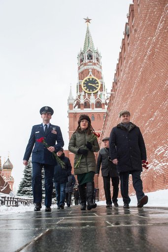 jsc2019e004433 - Expedition 59 crewmembers Nick Hague of NASA (left), Christina Koch of NASA (center) and Alexey Ovchinin of Roscosmos (right) walk along the Kremlin Wall in Moscow Feb. 21 as they prepare for the ceremonial laying of flowers as part of pr