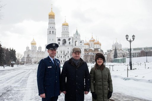jsc2019e004437 - Inside the Kremlin in Moscow, Expedition 59 crewmembers Nick Hague of NASA (left), Alexey Ovchinin of Roscosmos (center) and Christina Koch of NASA (right) pose for pictures on a wintry day Feb. 21 as part of their pre-launch activities.