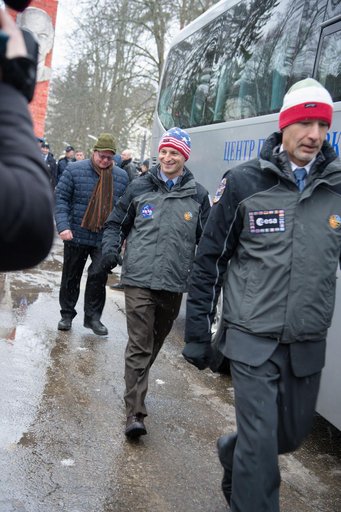 At the Gagarin Cosmonaut Training Center in Star City, Russia, Expedition 59 backup crewmembers Drew Morgan of NASA (center) and Luca Parmitano of the European Space Agency (right) walk to a bus Feb. 26 to take them to their plane for a flight to the Baik