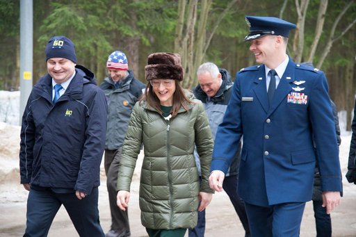 At the Gagarin Cosmonaut Training Center in Star City, Russia, Expedition 59 crewmembers Alexey Ovchinin of Roscosmos (left), Christina Koch of NASA (center) and Nick Hague of NASA (right) walk to a bus Feb. 26 to take them to their plane for a flight to