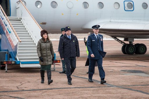 jsc2019e007200 - Expedition 59 crewmembers Christina Koch of NASA (left), Alexey Ovchinin of Roscosmos (center) and Nick Hague of NASA (right) arrive at the Baikonur Cosmodrome in Kazakhstan Feb. 26 for final pre-launch training following a flight from th