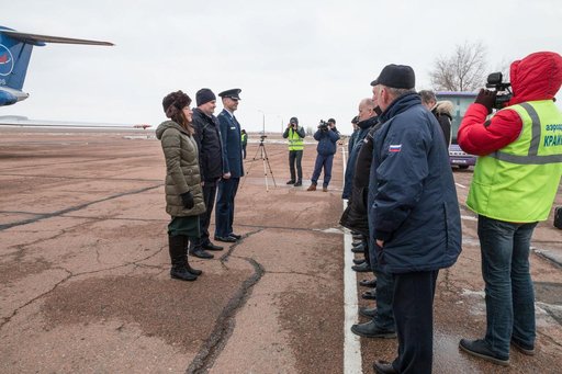 jsc2019e007201 - Expedition 59 crewmembers Christina Koch of NASA (left), Alexey Ovchinin of Roscosmos (center) and Nick Hague of NASA (right) meet with Russian space officials after arriving at the Baikonur Cosmodrome in Kazakhstan Feb. 26 for final pre-