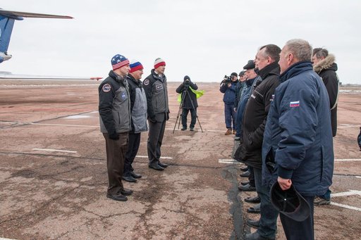 jsc2019e007204 - Expedition 59 backup crewmembers Drew Morgan of NASA (left), Alexander Skvortsov of Roscosmos (center) and Luca Parmitano of the European Space Agency (right) meet with Russian officials Feb. 26 after arriving at the Baikonur Cosmodrome i