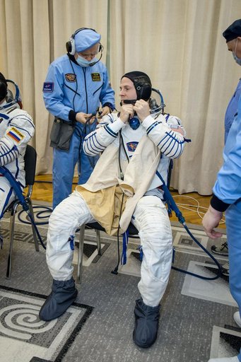 jsc2019e009946 - At the Baikonur Cosmodrome in Kazakhstan, Expedition 59 crewmember Nick Hague of NASA suits up for a Soyuz fit check dress rehearsal Feb. 27 during pre-launch training. Hague, Christina Koch of NASA and Alexey Ovchinin of Roscosmos will l