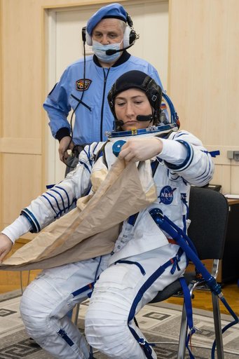 jsc2019e009947 - At the Baikonur Cosmodrome in Kazakhstan, Expedition 59 crewmember Christina Koch of NASA suits up for a Soyuz fit check dress rehearsal Feb. 27 during pre-launch training. Koch, Nick Hague of NASA and Alexey Ovchinin of Roscosmos will la