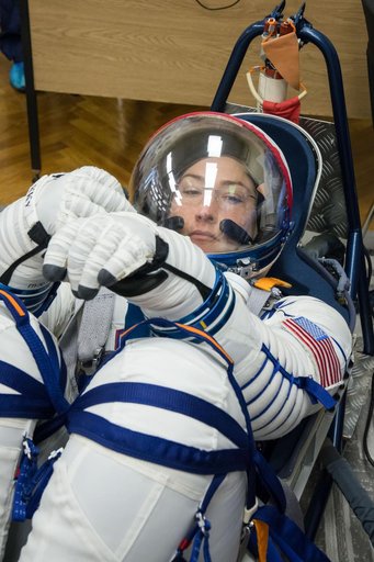 jsc2019e009954 - At the Baikonur Cosmodrome in Kazakhstan, Expedition 59 crewmember Christina Koch of NASA undergoes a Sokol launch suit pressure check Feb. 27 during pre-launch training. Koch, Nick Hague of NASA and Alexey Ovchinin of Roscosmos will laun