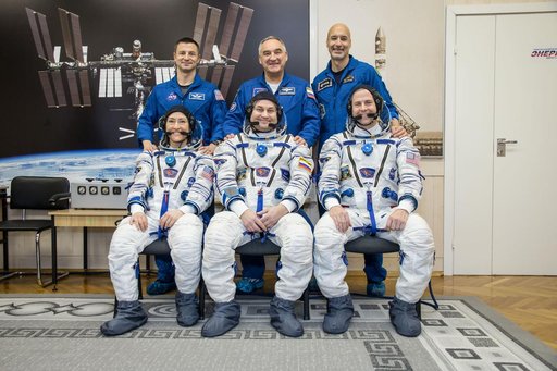 jsc2019e009955 - At the Baikonur Cosmodrome in Kazakhstan, the Expedition 59 prime and backup crewmembers pose for pictures Feb. 27 as part of their pre-launch training. In the front row are the prime crewmembers, Christina Koch of NASA, Alexey Ovchinin o