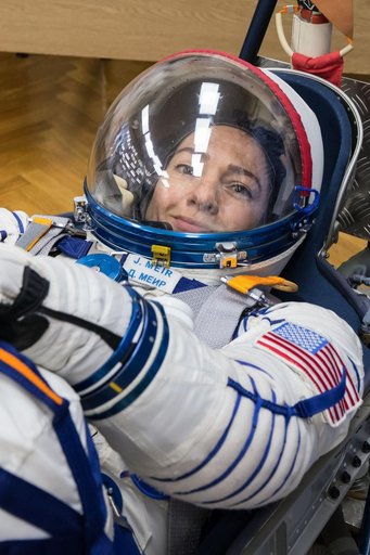 jsc2019e052887 - In the Integration Building at the Baikonur Cosmodrome in Kazakhstan, Expedition 61 crewmember Jessica Meir of NASA undergoes a pressure and leak check of her Russian Sokol launch and entry suit Sept. 11 for a fit check aboard the Soyuz M
