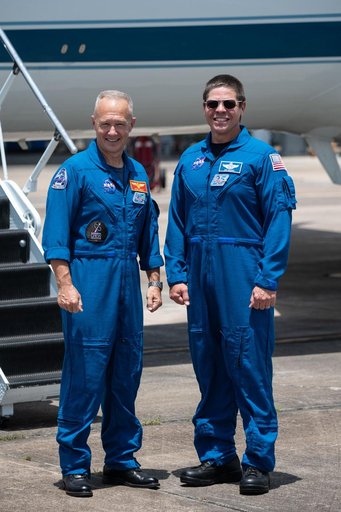 jsc2020e023069 - At Ellington Field near NASA’s Johnson Space Center in Houston, astronauts Douglas Hurley(left) and Robert Behnken pose for a photo before boarding the Gulfstream jet that will carry them to the agency’s Kennedy Space Center in Florid