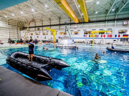 US Navy Divers practice recovery operations at JSC