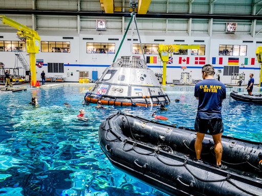 US Navy Divers practice recovery operations at JSC