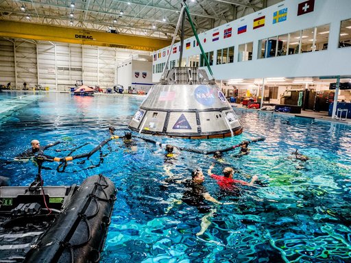 US Navy Divers practice recovery operations at JSC