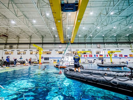US Navy Divers practice recovery operations at JSC