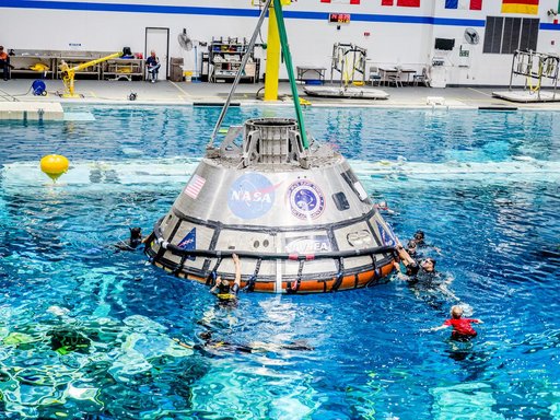 US Navy Divers practice recovery operations at JSC