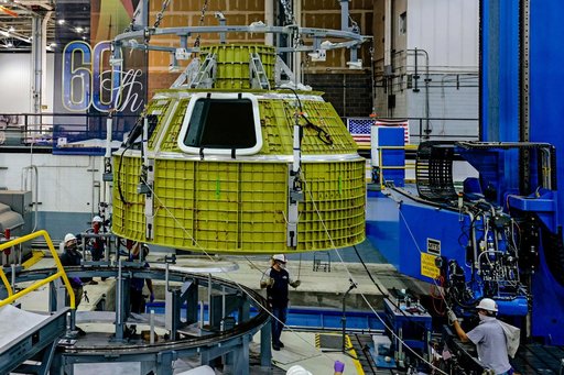Orion crew module pressure vessel lifted from welding tool