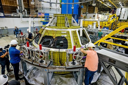 Orion crew module pressure vessel lifted from welding tool
