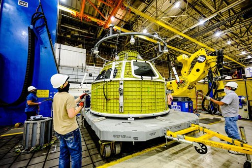 Orion crew module pressure vessel lifted from welding tool