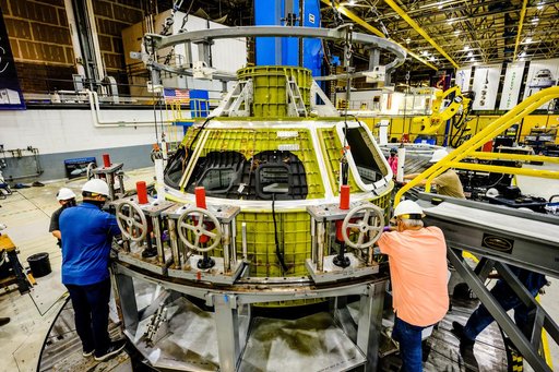 Orion crew module pressure vessel lifted from welding tool