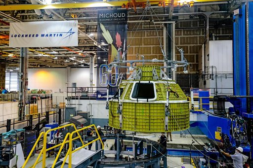 Orion crew module pressure vessel lifted from welding tool