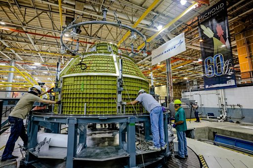 Orion crew module pressure vessel lifted from welding tool