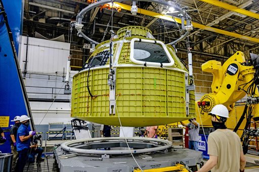 Orion crew module pressure vessel lifted from welding tool