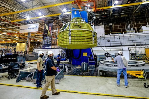 Orion crew module pressure vessel lifted from welding tool