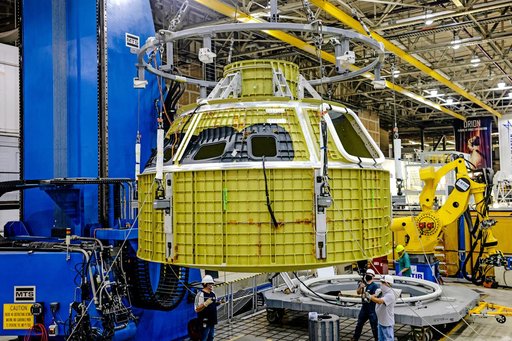 Orion crew module pressure vessel lifted from welding tool